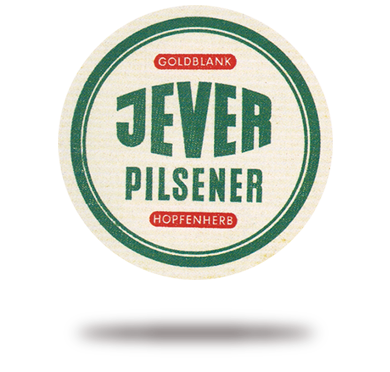 Rundes Etikett mit grüner und weißer Schrift, umrahmt von einer goldenen Linie.